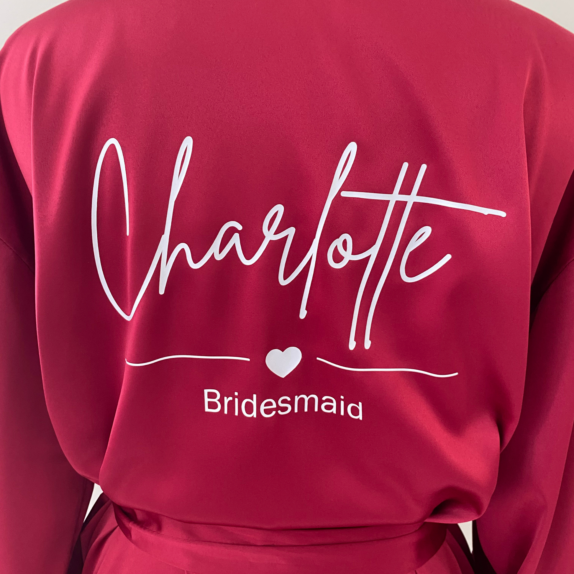 burgundy matchng bridesmaid robe with name on the back